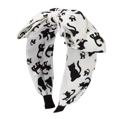 Spooky Chic – Halloween Haarreifen mit grosser Schleife und gruseligen Motiven