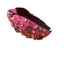 Bandeau rose avec noeuds et décoration strass