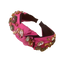 Bandeau rose avec noeuds et décoration strass