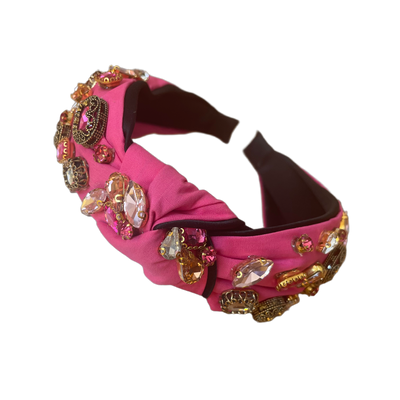 Bandeau rose avec noeuds et décoration strass