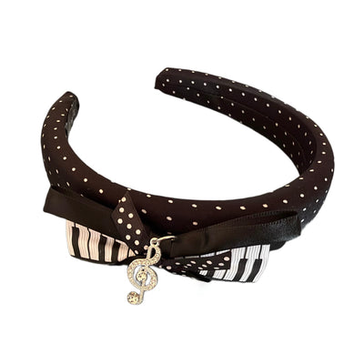 Melody of Love – Eleganter Haarreifen mit Schleife, Polka Dots und funkelndem Notenschlüssel